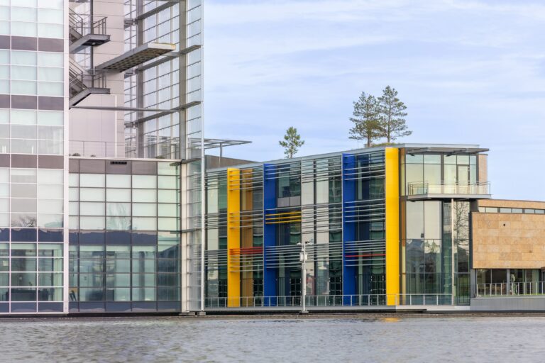 A large building sitting next to a body of water